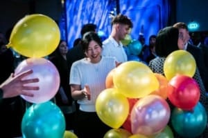 Taylor Hopkinson staff at office party, featuring balloons