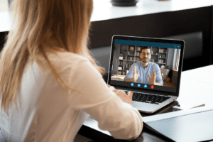 Business woman taking a video call with a colleague