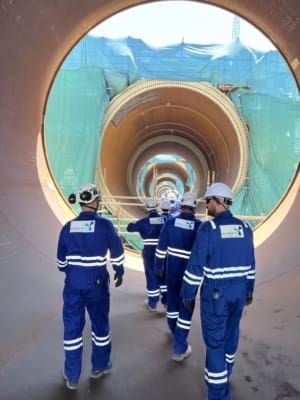 Offshore wind QAQC specialists employed by Taylor Hopkinson for Moray West Offshore Wind Farm inside an under-construction wind turbine tower.