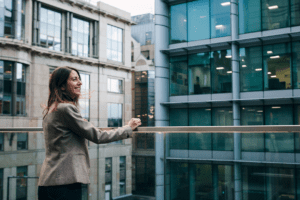 Taylor Hopkinson employee standing on balcony of the Glasgow office