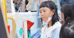Children building model offshore wind pylons for Wind4Kids APAC tour.