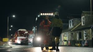 Taylor Hopkinson offshore wind contracting specialists supporting the Inch Cape Offshore Wind Farm project at night, as an enormous electrical transformer is transported through streets at night on articulated lorries.