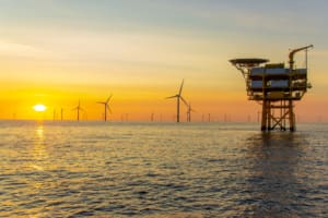 Offhsore wind farm and substation at sunset